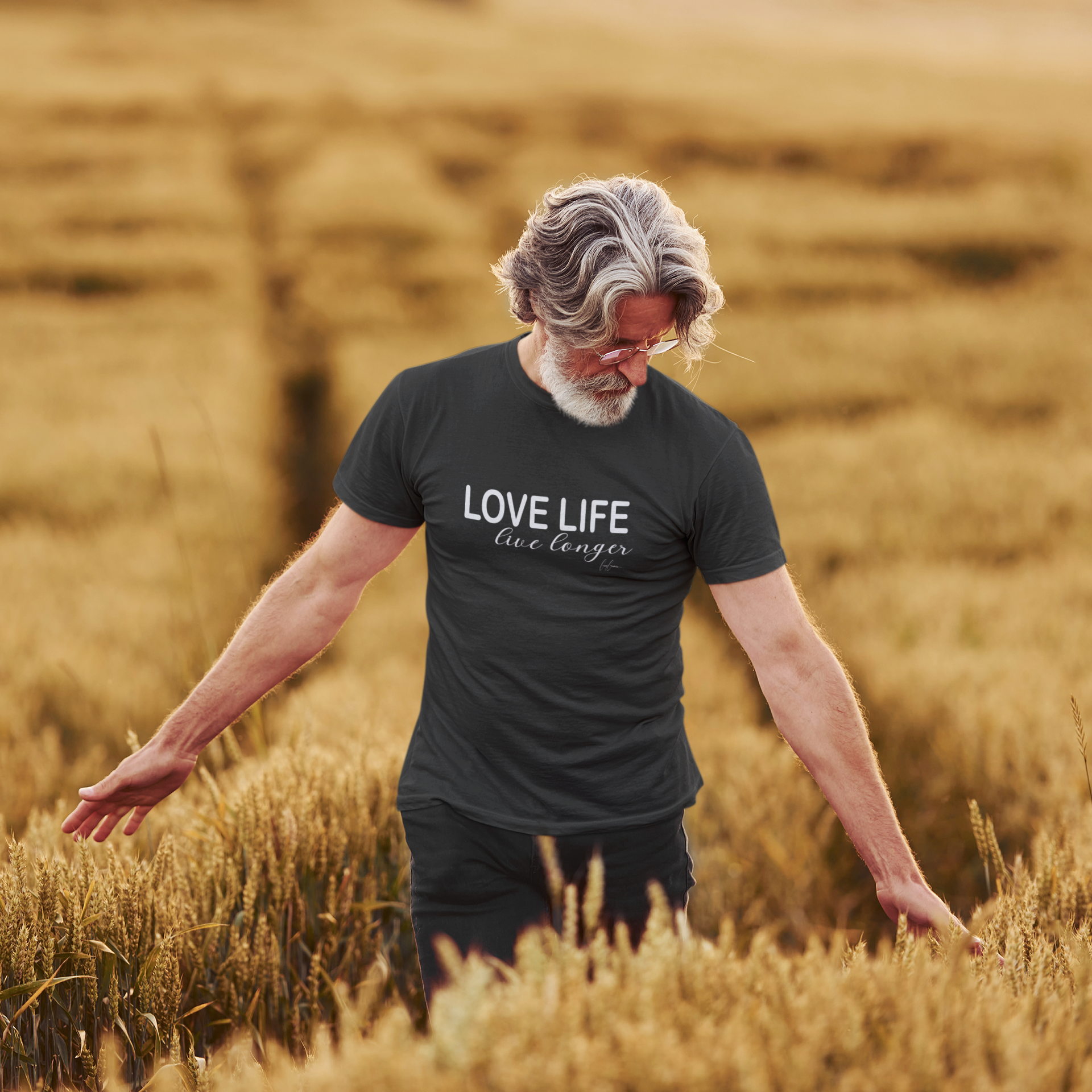 Man wearing dark gray t-shirt from My Weekend Tees with text Love Life Live Longer