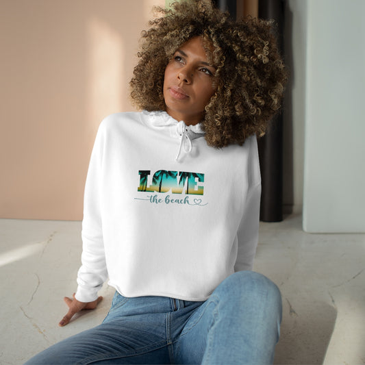 Woman-wearing-cropped-hoodie-with-quote-love-the-beach