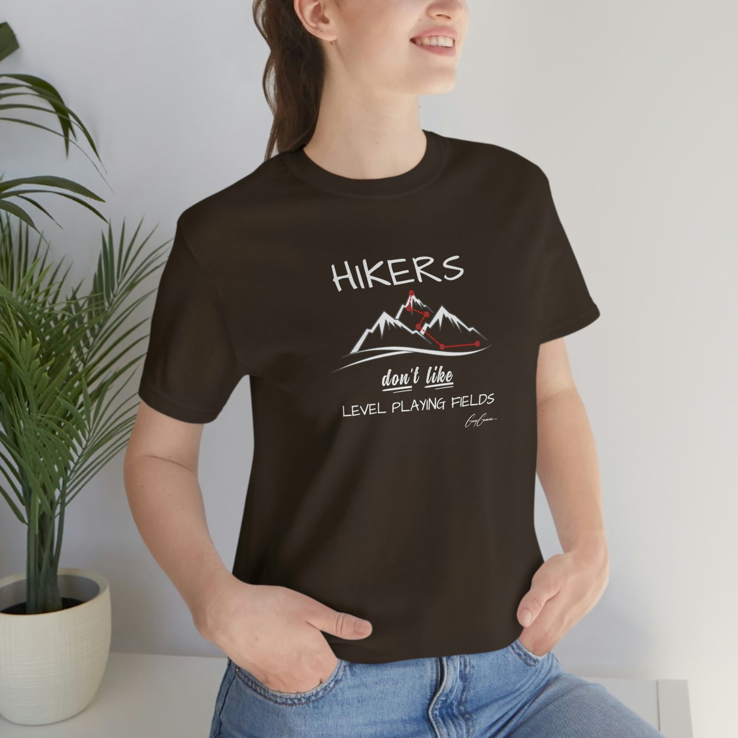 woman-wearing-graphic-tee-shirt-with-quote-hikers-don't-like-level-playing-fields