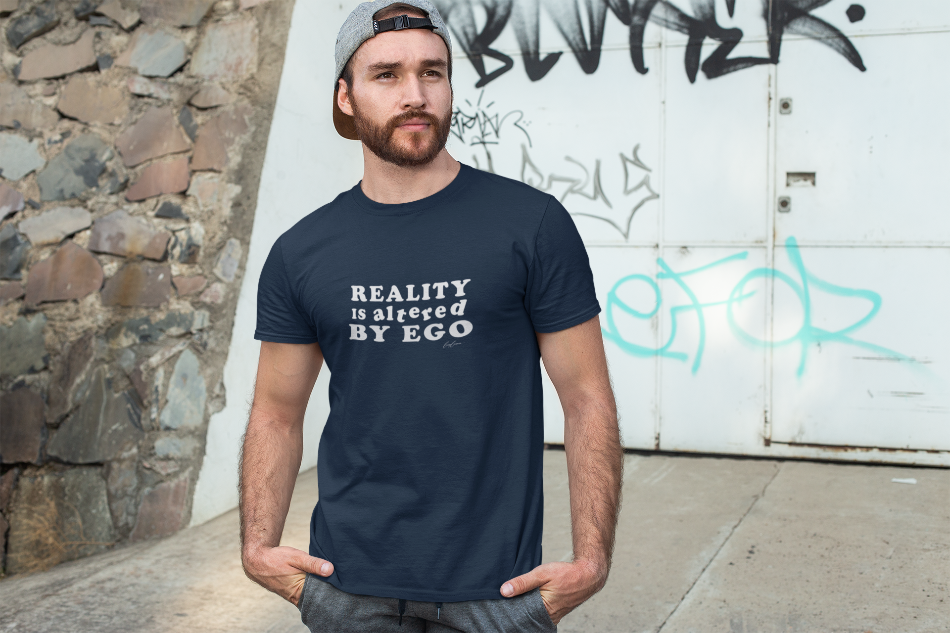 Man-wearing-humorous-t-shirt-with-quote-Reality-is-Altered-by-Ego