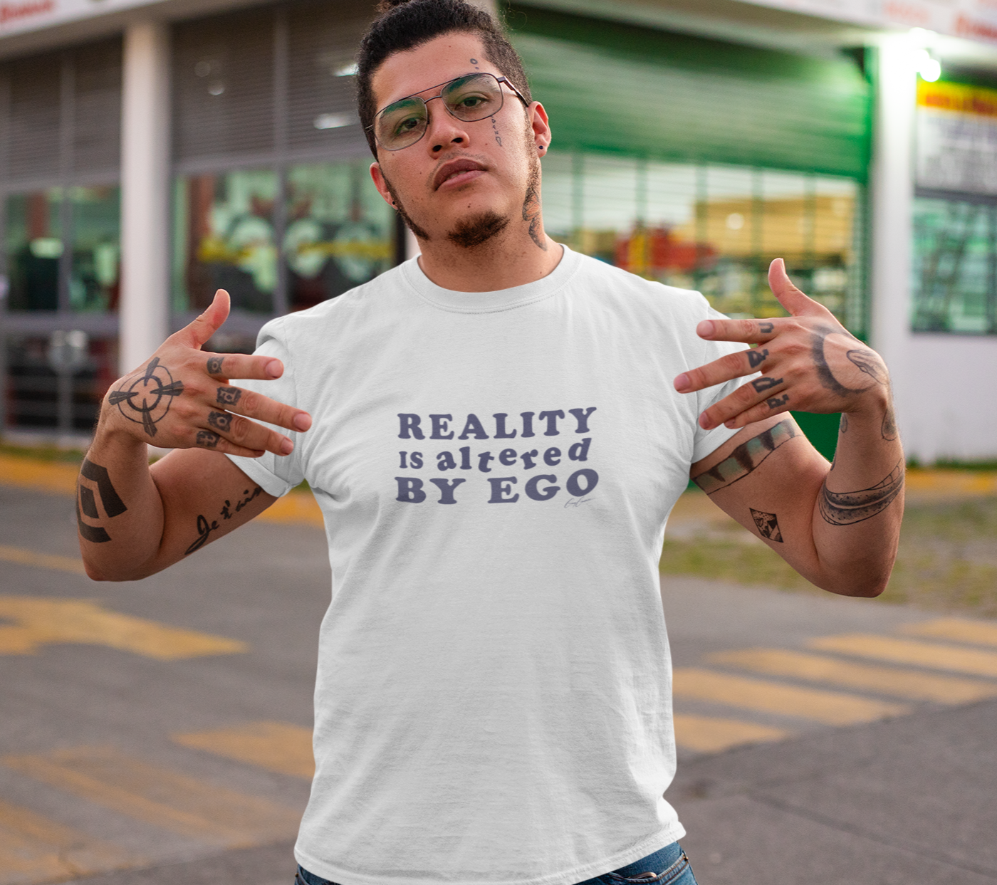 Man-wearing-funny-t-shirt-with-quote-reality-is-altered-by-ego